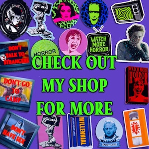May include: A collection of stickers and pins with a horror theme, featuring images of classic movie characters, vintage televisions, and the phrases "Watch More Horror" and "Check Out My Shop For More."