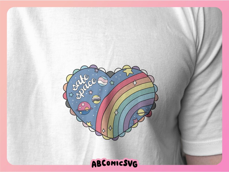 May include: A white t-shirt with a blue and rainbow heart design. The heart has stars, planets, and the text "safe space" inside.