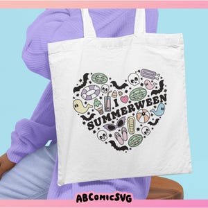 May include: White tote bag featuring a heart-shaped design with the text "I Summerween" and summer and Halloween-themed illustrations. The illustrations include ghosts, bats, skulls, and watermelon slices. The background is light blue and pink.