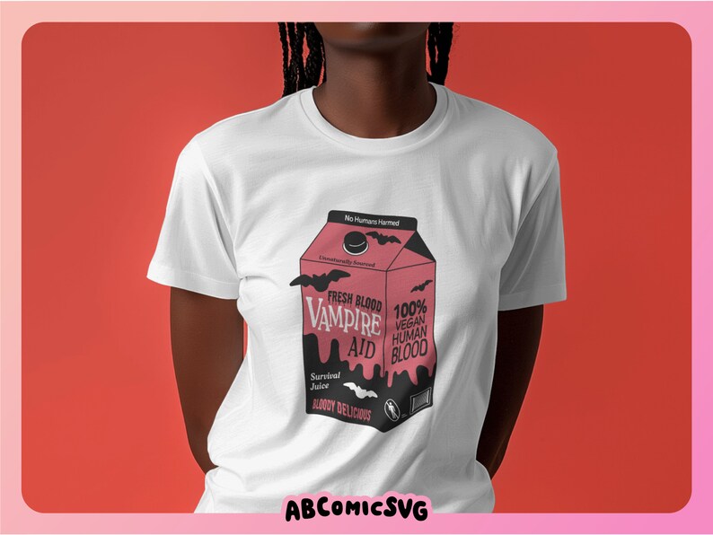 May include: White t-shirt with a graphic of a pink carton of "Fresh Blood Vampire Aid" with the text "100% Vegan Human Blood" and "Bloody Delicious".