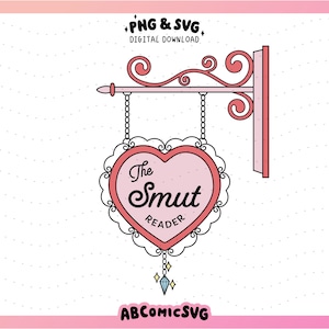 May include: A pink heart-shaped sign with the text "The Smut Reader" hanging from a decorative metal frame. The sign has a delicate lace border and a dangling crystal charm.