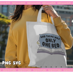 May include: A white tote bag with a blue pillow and a book design. The pillow has the text "And there was only one bed".