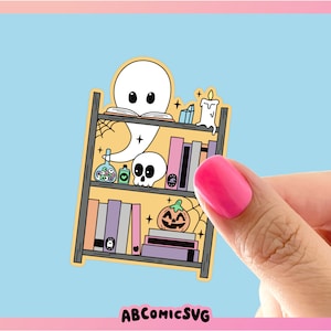 May include: A yellow bookshelf with a ghost, a skull, a pumpkin, and books. The bookshelf is decorated with stars, a spiderweb, and a candle.