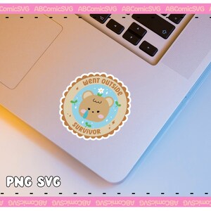 May include: A light blue and brown sticker with a cartoon bear wearing a flower crown. The sticker says "Went Outside Survivor" with a star and a small flower.