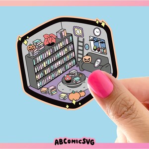 May include: A sticker featuring a cartoon illustration of a cozy living room with a bookshelf filled with colorful books, a couch, a coffee table with a pumpkin and a book, and a ladder. The sticker has a light blue background and the text "ABCOMICSVG" at the bottom.