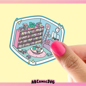 May include: A blue and pink illustrated sticker of a small room with a bookshelf full of books, a ladder, a couch, a coffee table with a plant and books, and a clock on the wall. The sticker has a sparkly border and the text "ABCOMICSVG" at the bottom.