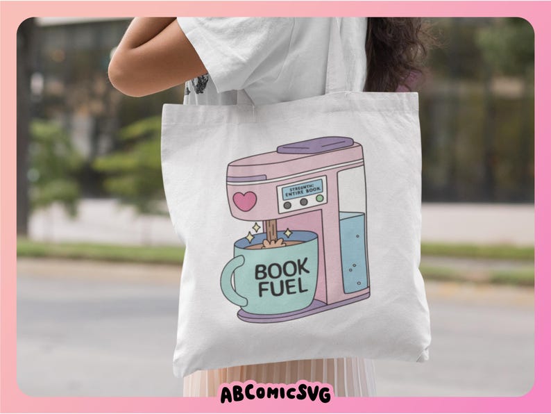 May include: White tote bag featuring a pink coffee maker illustration with a heart and the text "BOOK FUEL" on a blue mug. The coffee maker has the text "ESSENTIAL ENTIRE BOOK". The bag has the text "ABCOMICSVG" at the bottom.