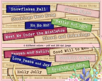 May include: A collection of 100 Christmas-themed phrases printed on colorful paper squares with a watercolor floral design and a deer antler in the background. The phrases include "Snowflakes Fall", "Silent Night", "Ho Ho Ho!" and "Goodwill to Men".