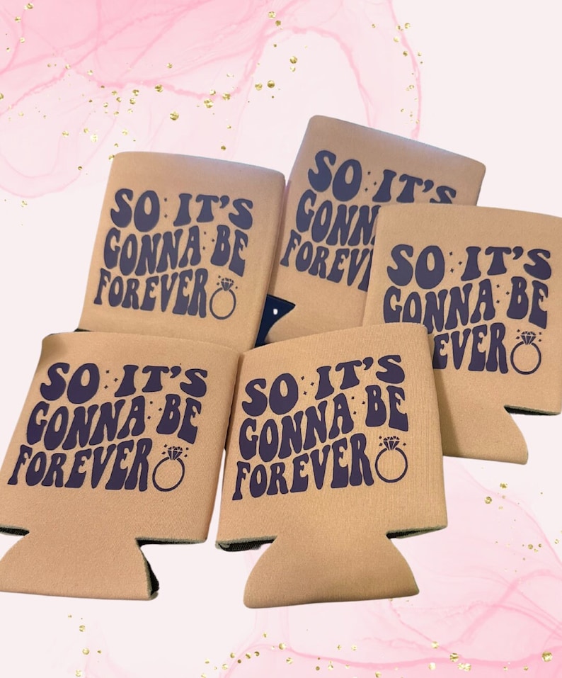 May include: A collection of beige can coolers with the text "SO IT'S GONNA BE FOREVER" in dark blue, along with a ring graphic. The coolers are designed to hold beverage cans and bottles.