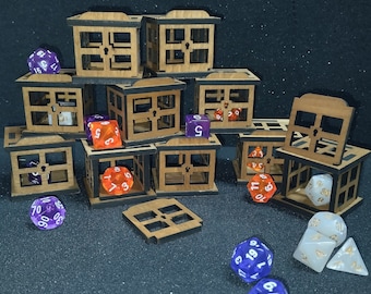 May include: A collection of wooden boxes with open fronts, stacked and arranged in a pyramid shape. The boxes are made of light brown wood and have a grid pattern on the front. There are several multi-colored dice scattered around the boxes.