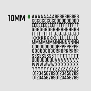 May include: A black and white chart displaying the letters of the alphabet and numbers, with the text "10MM" and a green square in the upper left corner. The characters are arranged in rows.