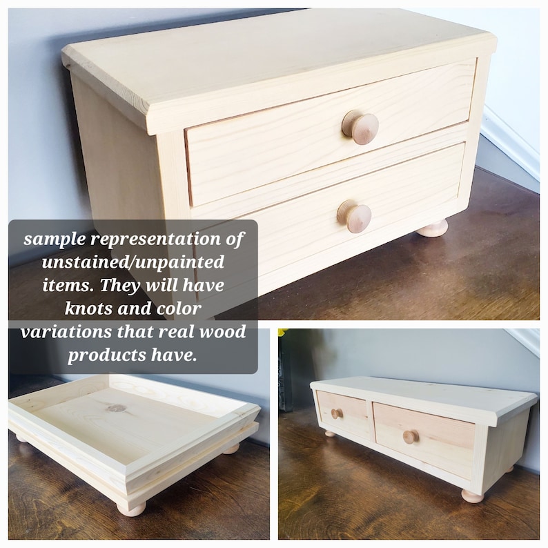 May include: A light-colored, unfinished wooden chest with two drawers, each featuring a round wooden knob and supported by four small feet. The image includes text stating: sample representation of unstained/unpainted items. They will have knots and color variations that real wood products have.