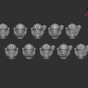 Könnte beinhalten: Zehn graue Plastikhelme mit Totenkopfmotiven und verschiedenen Details. Die Helme sind in zwei Reihen zu fünf angeordnet.