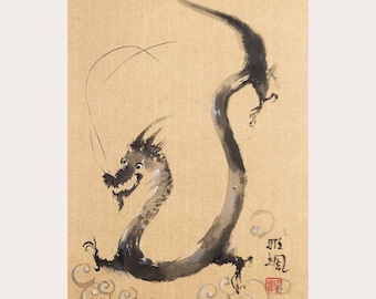 May include: A black ink wash painting of a long, serpentine dragon on light brown textured paper. The dragon has a curved body, claws, and whiskers. Black calligraphy characters and a small red square seal are visible, along with the text yasa-studios.com.