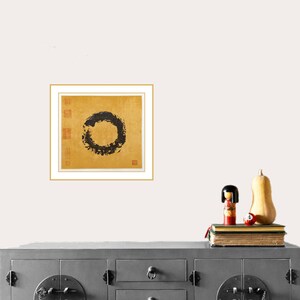 Enso painting on the  wall above Chinese-style console. A book, a Japanese kokeshi doll and butternut squash pumpkin are on the console for demonstration purposes.
