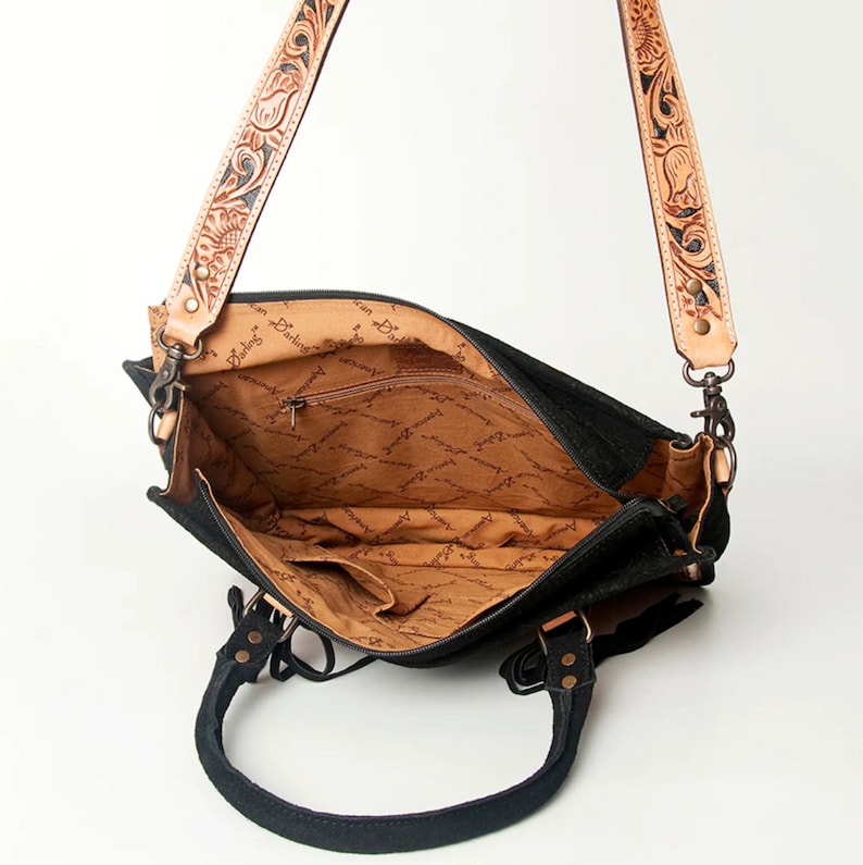 Country Style Handbag Western Leather Construction Hand Tooled Artistry Premium Cowhide Material Floral Pattern Design Fringe Detail Accent Concealed Carry Feature Removable Shoulder Strap Practical Storage Solution Fashion Forward