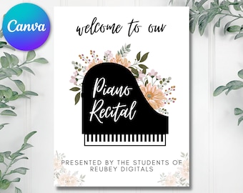 May include: A white sign with the text "Welcome to our Piano Recital" in black lettering. The sign is decorated with a black silhouette of a piano with floral accents in shades of pink and peach.