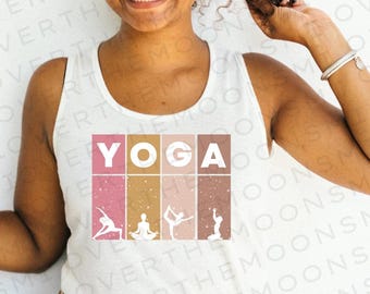 May include: A white tank top with the word "YOGA" printed in pink, gold, and brown. The word is surrounded by four silhouettes of people doing yoga poses.
