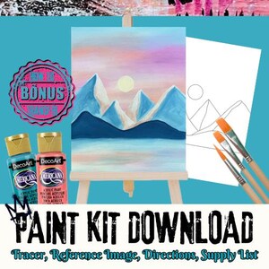 May include: A paint kit download with a landscape painting on a miniature easel. The painting shows blue mountains under a pink and yellow sky. The kit includes paint bottles, brushes, a reference image, and the text "PAINT KIT DOWNLOAD".