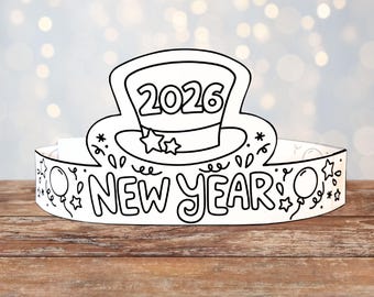 May include: A black and white New Year's crown with the year 2026 on a top hat design. The crown is decorated with stars, balloons, and the words "NEW YEAR" in a playful font. It is set against a blurred background.