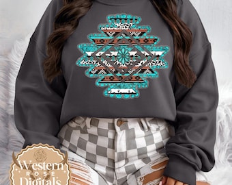 May include: Dark grey sweatshirt with a turquoise, brown, and white geometric design. The design includes animal print, cacti, and other southwestern motifs. The sweatshirt has a crew neck and long sleeves.
