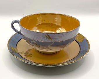 Orange and blue lusterware, designed with egret birds and gold trim, hand painted vintage cup & saucer set.