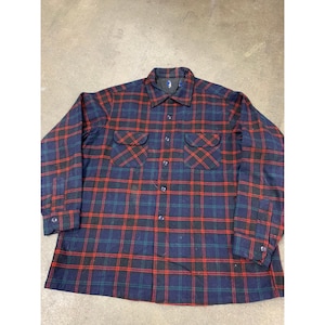 May include: A long-sleeved plaid shirt with a button-up front. The shirt is blue, red, and green.