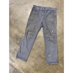 May include: Gray work pants with white paint splatters. The pants have a straight leg and a classic five-pocket design.