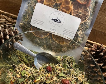 May include: A clear plastic bag filled with dried herbs and orange slices. The bag has a label that reads "Appalachian Herbals Allergy". The label also lists the ingredients: "Dried Yarrow, Stinging Nettle, Red Clover, Calendula, Marshmallow Root, Plantain Leaf, Astragalus, Echinacea, Elderberry, Goldenseal, and Lemon Balm."