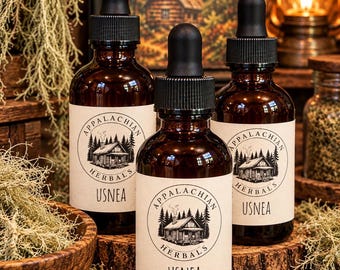 May include: Three amber glass dropper bottles with black caps, each featuring a white label with the text Appalachian Herbals Usnea and a graphic of a cabin in the woods. The bottles are arranged on a wooden surface with dried lichen.