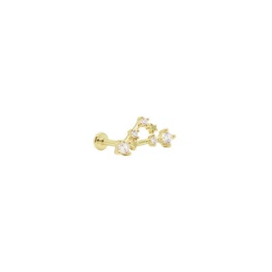 May include: Gold constellation ear cuff with clear cubic zirconia stones.