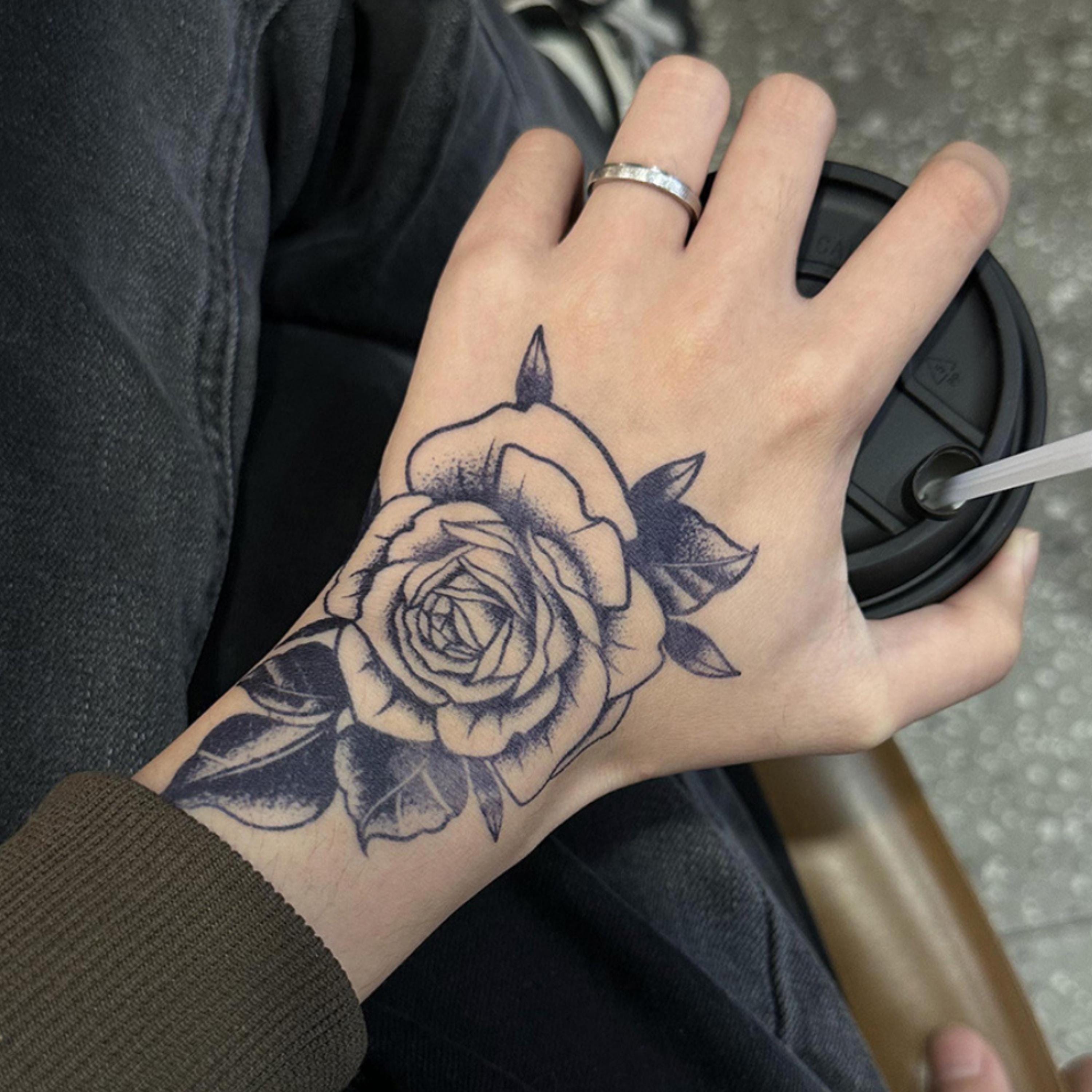 Hand Flower Tattoos That Bloom with Style
