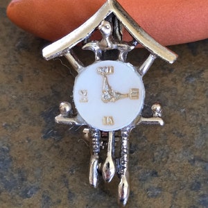 Cuckoo clock pin goldtone with white face lapel pin