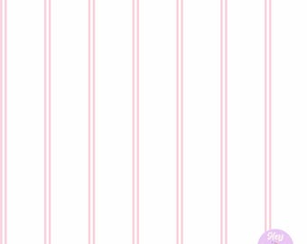 May include: White background with vertical pink stripes. The stripes are evenly spaced and create a clean, minimalist design. A small, round sticker with the text "Hey Lillywhite" is in the bottom right corner.