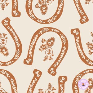 May include: Seamless pattern featuring horseshoe shapes and cactus illustrations in a warm brown color, set against a cream background. The horseshoes are adorned with leaf-like patterns, and the cacti have a unique, stylized design.