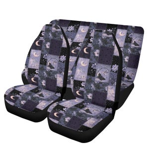 May include: A set of car seat covers featuring a dark purple and black patchwork design. The pattern includes alternating squares with floral motifs, crescent moons, and butterfly illustrations, finished with solid black side panels and trim.