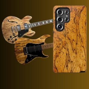 May include: Two electric guitars and a phone case with a wood grain finish. The guitars have a light brown wood grain body with black accents. The phone case has a similar wood grain pattern.