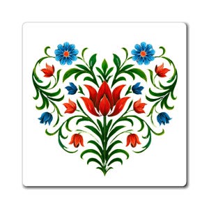 May include: A white square magnet featuring a heart-shaped floral design. The design includes a central red flower, green leaves, and accents of blue and red flowers. The artwork has a folk art style.