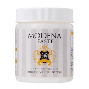 May include: A white plastic jar of Modena Paste air dry polymer clay. The jar has a white lid and a label with the words "MODENA PASTE" in black, along with a gold emblem. The net weight is 250g.