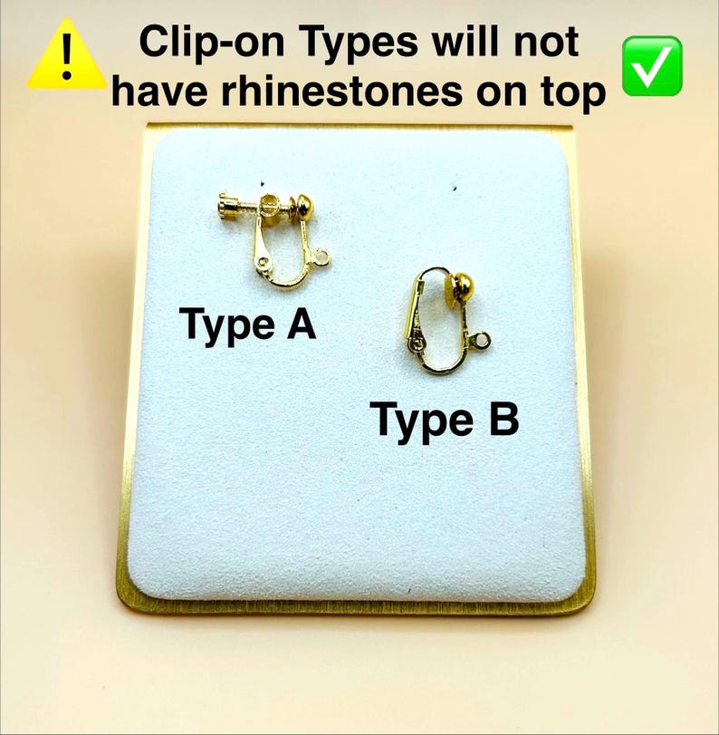 May include: Two gold-toned metal clip-on earring findings labelled Type A and Type B. Type A features a screw-back mechanism, while Type B is a standard clip-on. Text states: Clip-on Types will not have rhinestones on top.