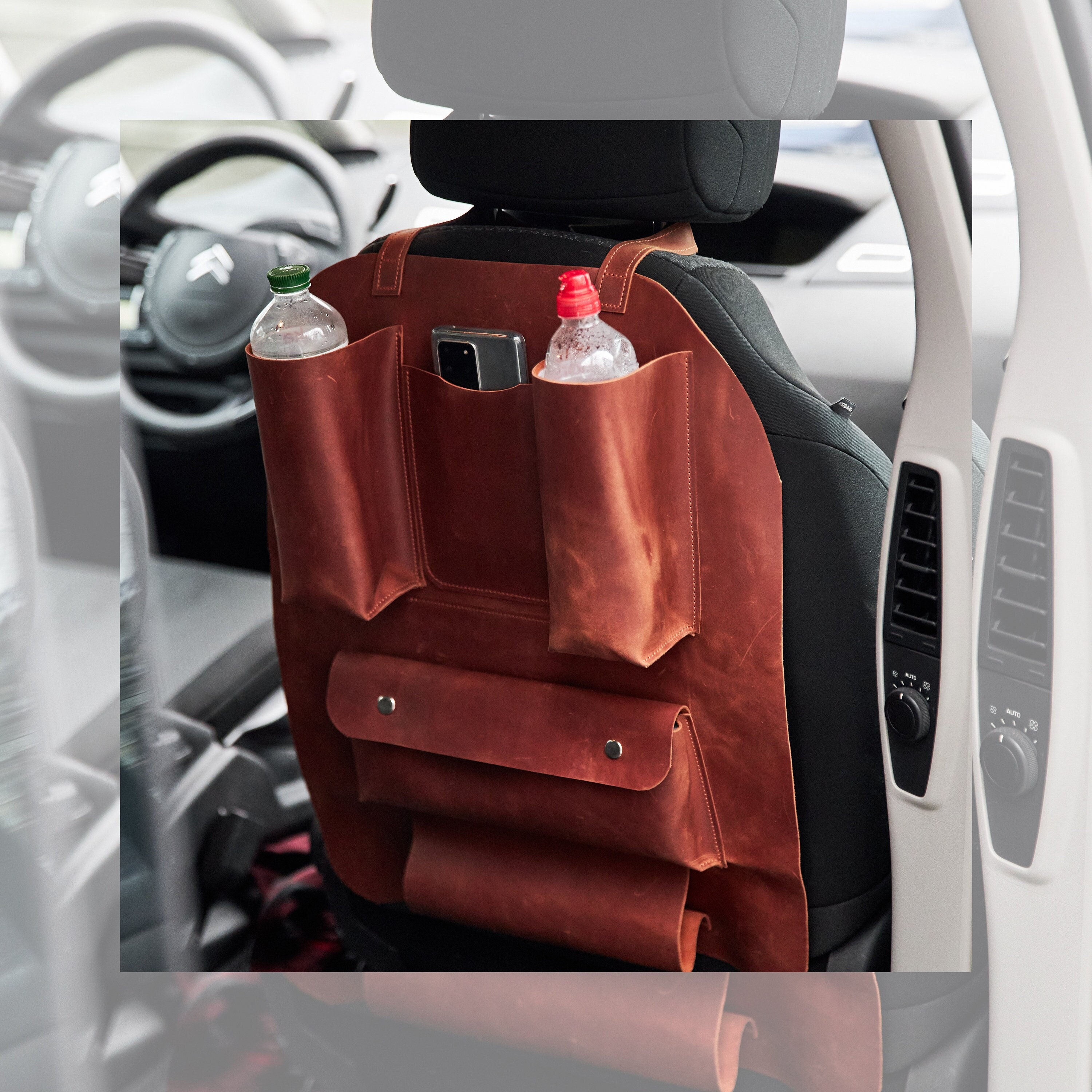 Front passenger seat organizer outlet
