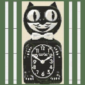 May include: Black cat-shaped clock with a white bow tie and large, oval eyes. The clock face features white numerals and hands against a black background. The clock reads "wake up" and is set against a light beige background.