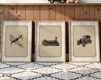 May include: Three framed vintage transportation prints: an airplane, a train, and a car. Each black and white illustration is set against a tan background with a decorative border. The frames are light wood, and the prints are displayed on a wooden shelf.