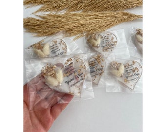 Heart-shaped epoxy magnets with dried flowers.