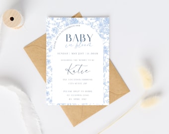 May include: A blue and white baby shower invitation with a floral design. The invitation reads "Baby in Bloom" and includes the date and time of the shower, the name of the mother-to-be, Katie, and the RSVP information.