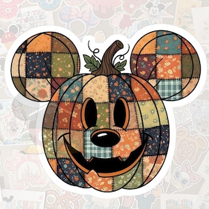 May include: A sticker featuring a patchwork pumpkin with Mickey Mouse ears and a smiling jack-o'-lantern face. The pumpkin is composed of various fabric patterns in orange, green, and blue. The background is white with other stickers.