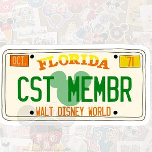 May include: A sticker in the shape of a Florida license plate with the words "FLORIDA" in orange and yellow, and "CST MEMBR" in green. The words "WALT DISNEY WORLD" are at the bottom.