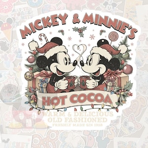 May include: A sticker featuring Mickey and Minnie Mouse in Santa hats, holding mugs of hot cocoa. The design includes a banner that reads "Hot Cocoa" and the text "Warm & Delicious Old Fashioned Freshly Made Sin 1928".