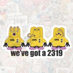 May include: Three yellow CDA stickers with black gloves and purple shoes. The stickers have a cartoon design with the text "we've got a 2319" in black and white.
