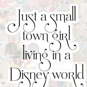 May include: White sticker with black text that reads "Just a small town girl living in a Disney world." The sticker is surrounded by various colorful Disney-themed stickers.